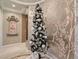 Elegant entryway featuring a festive Christmas tree and decorative wall art at 2038 Cherry Creek Cir, Las Vegas, NV 89135
