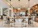 A spacious kitchen with a large island, granite countertops, and pendant lighting, ideal for cooking and entertaining at 2038 Cherry Creek Cir, Las Vegas, NV 89135