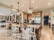 A spacious kitchen boasting an island with seating, stainless steel appliances and tile flooring at 2038 Cherry Creek Cir, Las Vegas, NV 89135