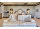 Neutral main bedroom with crown molding and damask wallpaper, featuring a sofa-style headboard at 2038 Cherry Creek Cir, Las Vegas, NV 89135