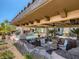 Covered outdoor kitchen with bar seating overlooking the pool and waterfall feature at 2038 Cherry Creek Cir, Las Vegas, NV 89135