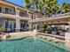 Luxury backyard features a pool with swim-up bar, covered outdoor kitchen and patio, perfect for entertaining at 2038 Cherry Creek Cir, Las Vegas, NV 89135