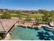 Backyard pool features a swim up bar and views of the lush golf course at 2038 Cherry Creek Cir, Las Vegas, NV 89135
