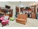 Large walk-in closet with custom shelving, seating, cabinets, and a TV at 2038 Cherry Creek Cir, Las Vegas, NV 89135