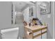 Bathroom featuring a mirrored vanity and toilet at 2200 S Fort Apache Rd # 1007, Las Vegas, NV 89117