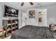 Cozy bedroom featuring a ceiling fan and wall-mounted TV for comfortable living at 2200 S Fort Apache Rd # 1007, Las Vegas, NV 89117