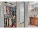Walk-in closet with ample storage for clothing and accessories, leading to the bathroom at 2200 S Fort Apache Rd # 1007, Las Vegas, NV 89117