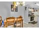 Dining room area featuring a wooden table with a pendant light fixture overhead at 2200 S Fort Apache Rd # 1007, Las Vegas, NV 89117