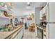 Bright kitchen with white cabinets and a view of the adjacent dining area, creating a welcoming space at 2200 S Fort Apache Rd # 1007, Las Vegas, NV 89117