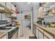 Efficient kitchen with modern appliances and tile flooring, offering a convenient cooking environment at 2200 S Fort Apache Rd # 1007, Las Vegas, NV 89117