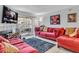 Bright living room features a cozy seating area, a fireplace, and a sliding glass door at 2200 S Fort Apache Rd # 1007, Las Vegas, NV 89117