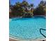 Sparkling community pool with waterfall feature at 2200 S Fort Apache Rd # 1007, Las Vegas, NV 89117