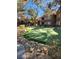Community putting green surrounded by trees and landscaping at 2200 S Fort Apache Rd # 1007, Las Vegas, NV 89117