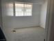 This bedroom features neutral walls, plush carpeting, and a window for natural light at 2736 Stargate St, Las Vegas, NV 89108