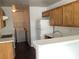 Functional kitchen with ample cabinet space and modern appliances, including a washer and dryer at 2736 Stargate St, Las Vegas, NV 89108