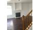 Cozy living room featuring a fireplace, hardwood floors, and plenty of natural light at 2736 Stargate St, Las Vegas, NV 89108