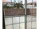 Enclosed patio offers privacy with block wall and view of palm trees at 2736 Stargate St, Las Vegas, NV 89108