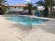 This community pool is surrounded by lush palms, creating a relaxing oasis at 2736 Stargate St, Las Vegas, NV 89108