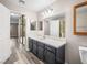 Well-lit bathroom features a large mirror, single sink vanity, and neutral decor, creating a pleasant space at 2851 S Valley View Blvd # 1150, Las Vegas, NV 89102