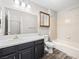 Full bathroom featuring a single sink vanity, with a shower and bath combo, and neutral wall tile at 2851 S Valley View Blvd # 1150, Las Vegas, NV 89102