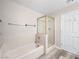Clean bathroom with a bathtub and shower, tiled walls, and updated with modern fixtures at 2851 S Valley View Blvd # 1150, Las Vegas, NV 89102