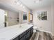 Bright bathroom with a single sink vanity, with a shower and bath combo, and a large mirror at 2851 S Valley View Blvd # 1150, Las Vegas, NV 89102