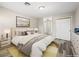 Cozy bedroom with soft lighting, neutral tones, and a comfy bed with a colorful area rug at 2851 S Valley View Blvd # 1150, Las Vegas, NV 89102