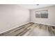 Bright bedroom with hardwood floors, a window providing natural light, and minimalist decor at 2851 S Valley View Blvd # 1150, Las Vegas, NV 89102