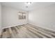 Cozy bedroom with hardwood floors and window providing natural light, a simple yet inviting space at 2851 S Valley View Blvd # 1150, Las Vegas, NV 89102