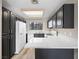 Modern kitchen with dark cabinets, stainless steel appliances, and sleek countertops at 2851 S Valley View Blvd # 1150, Las Vegas, NV 89102