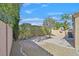 Low-maintenance backyard featuring desert landscaping with rock and minimal foliage at 301 Treehouse Ct, Henderson, NV 89012