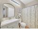 Well-lit bathroom features a framed mirror, single sink vanity and shower/tub combo at 301 Treehouse Ct, Henderson, NV 89012