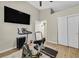 Bedroom converted to workout room has ceiling fan, wood flooring, and closet space at 301 Treehouse Ct, Henderson, NV 89012