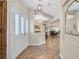 Inviting home entryway featuring wood floors, a bright interior, and stylish architectural details at 301 Treehouse Ct, Henderson, NV 89012