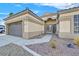 Close-up of a well-maintained home's front entrance with a gated courtyard and neutral color scheme at 301 Treehouse Ct, Henderson, NV 89012
