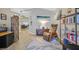 Inviting home office with wood floors, plantation shutters, a bookshelf, and modern decor at 301 Treehouse Ct, Henderson, NV 89012