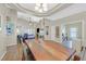 Spacious living and dining area with an open layout, fireplace, and ample natural light at 301 Treehouse Ct, Henderson, NV 89012