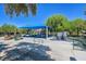 Community playground featuring climbing structures, slides, and shaded seating for Gathering enjoyment at 301 Treehouse Ct, Henderson, NV 89012