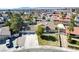 Aerial view of house featuring a 3-car garage, tile roof, pool and mature landscaping, near downtown at 3431 Iberia St, Las Vegas, NV 89146
