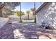 Spacious backyard featuring a pool, patio with pavers, and well-maintained landscaping with palm trees at 3431 Iberia St, Las Vegas, NV 89146