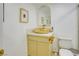Bathroom with golden sink, golden mirror and contemporary design with white toilet at 3431 Iberia St, Las Vegas, NV 89146