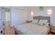 Bedroom features light-colored walls, wood-like floors, and a comfortable queen bed at 3431 Iberia St, Las Vegas, NV 89146