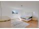 Bright bedroom with white walls, wood floors, and a large window with natural light at 3431 Iberia St, Las Vegas, NV 89146