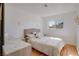 Bedroom featuring light-colored walls, wood-like floors, and a comfortable queen bed at 3431 Iberia St, Las Vegas, NV 89146
