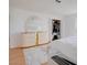 Bright bedroom featuring white walls, wood floors, a closet, and a dresser with a mirror at 3431 Iberia St, Las Vegas, NV 89146