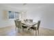 Dining room featuring a modern chandelier, a window, and seating for six at 3431 Iberia St, Las Vegas, NV 89146