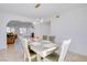 Dining room featuring a modern chandelier, a window, and seating for six at 3431 Iberia St, Las Vegas, NV 89146
