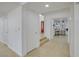 Bright entryway featuring tile flooring, a closet, and an arched doorway with a glimpse into a room with built-in shelving at 3431 Iberia St, Las Vegas, NV 89146