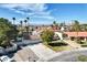 Charming home featuring a 3-car garage, tile roof, pool and mature landscaping, under a bright blue sky at 3431 Iberia St, Las Vegas, NV 89146