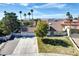 Charming home featuring a 3-car garage, tile roof, and well-manicured lawn with mature trees and shrubs at 3431 Iberia St, Las Vegas, NV 89146